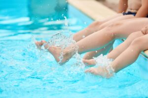 Children splashing in a St Simons Island Pool.